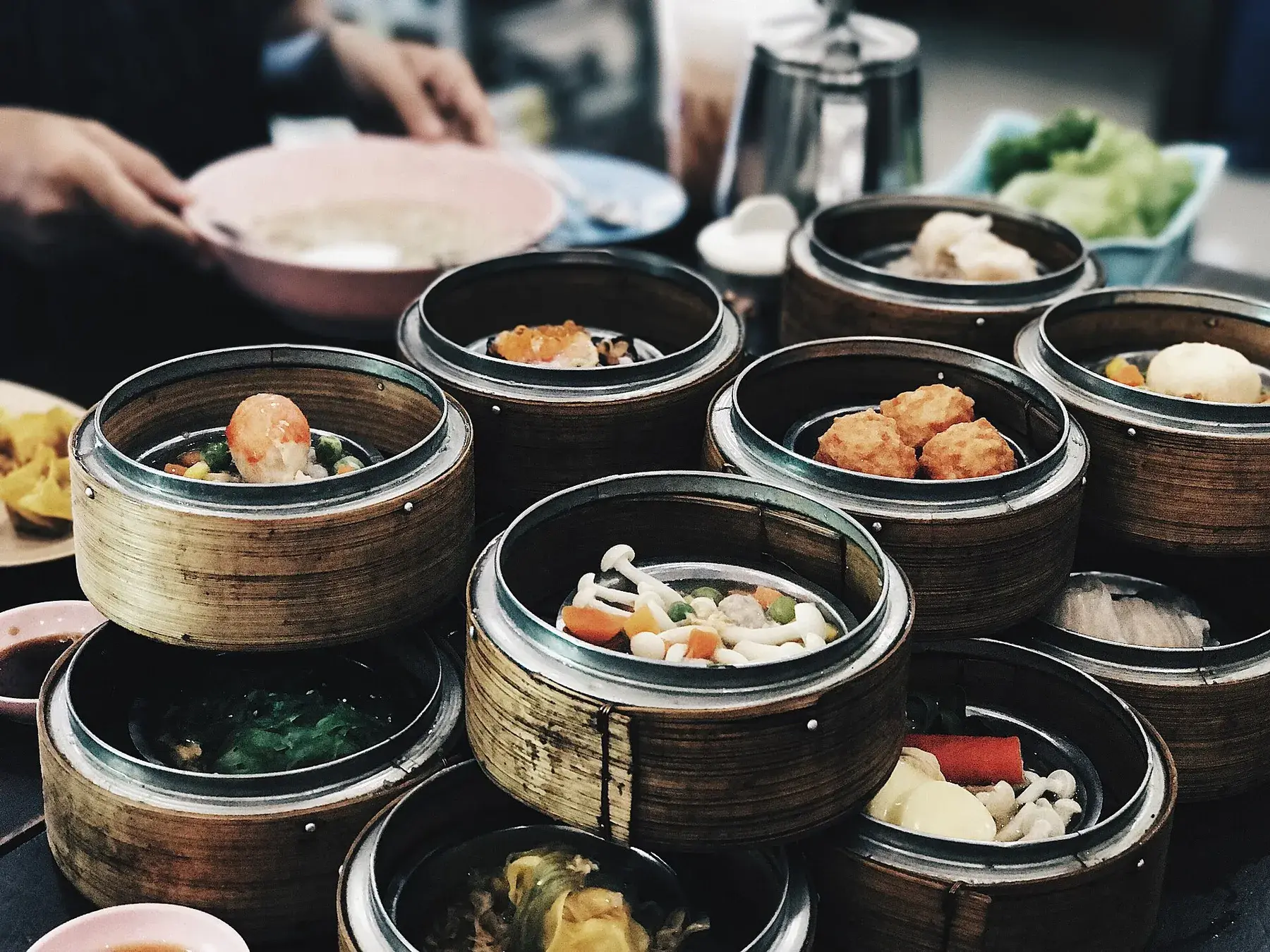 Bamboo steamer baskets of dim sum on a breakfast table