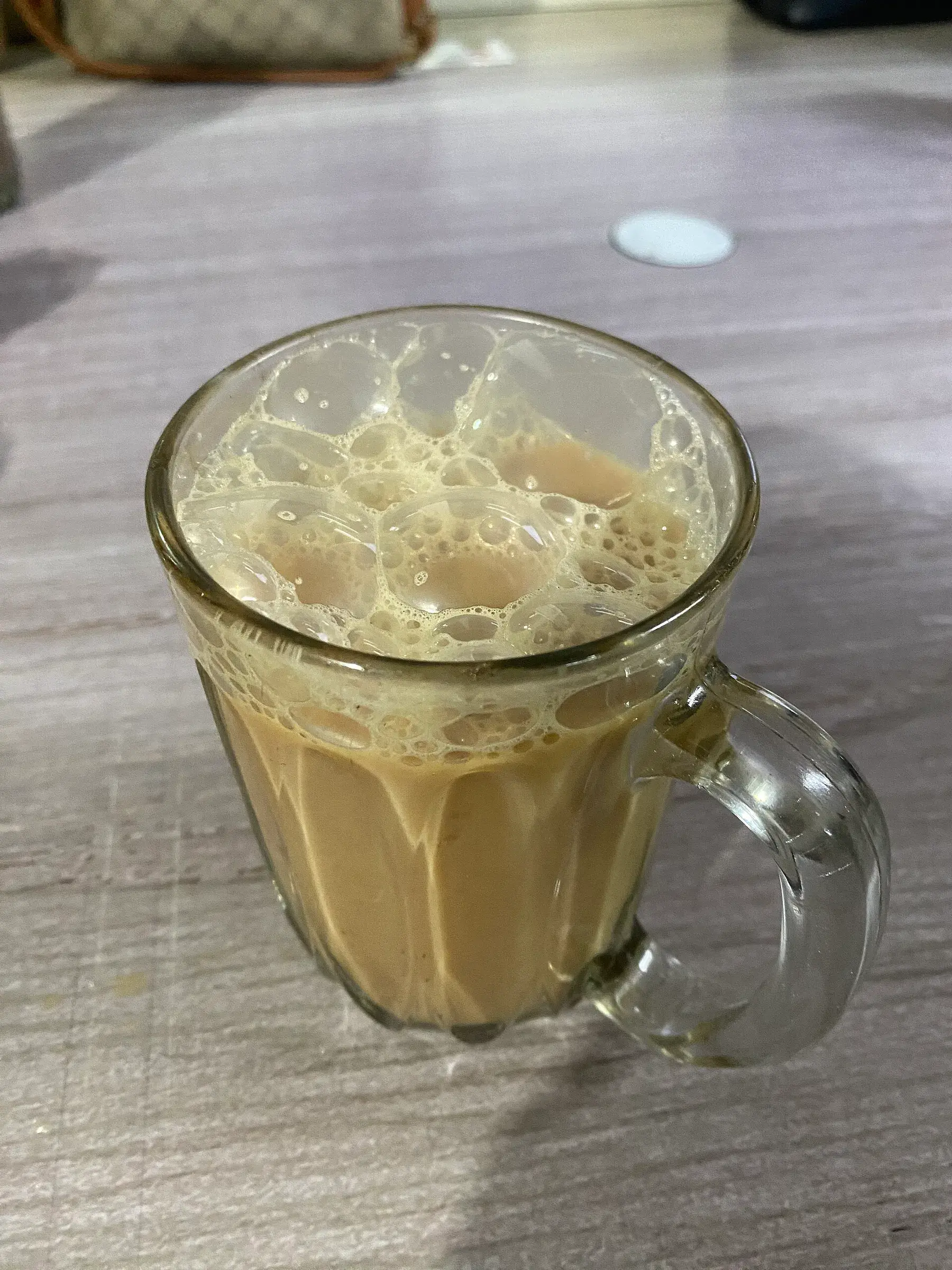 Glass of frothy teh tarik