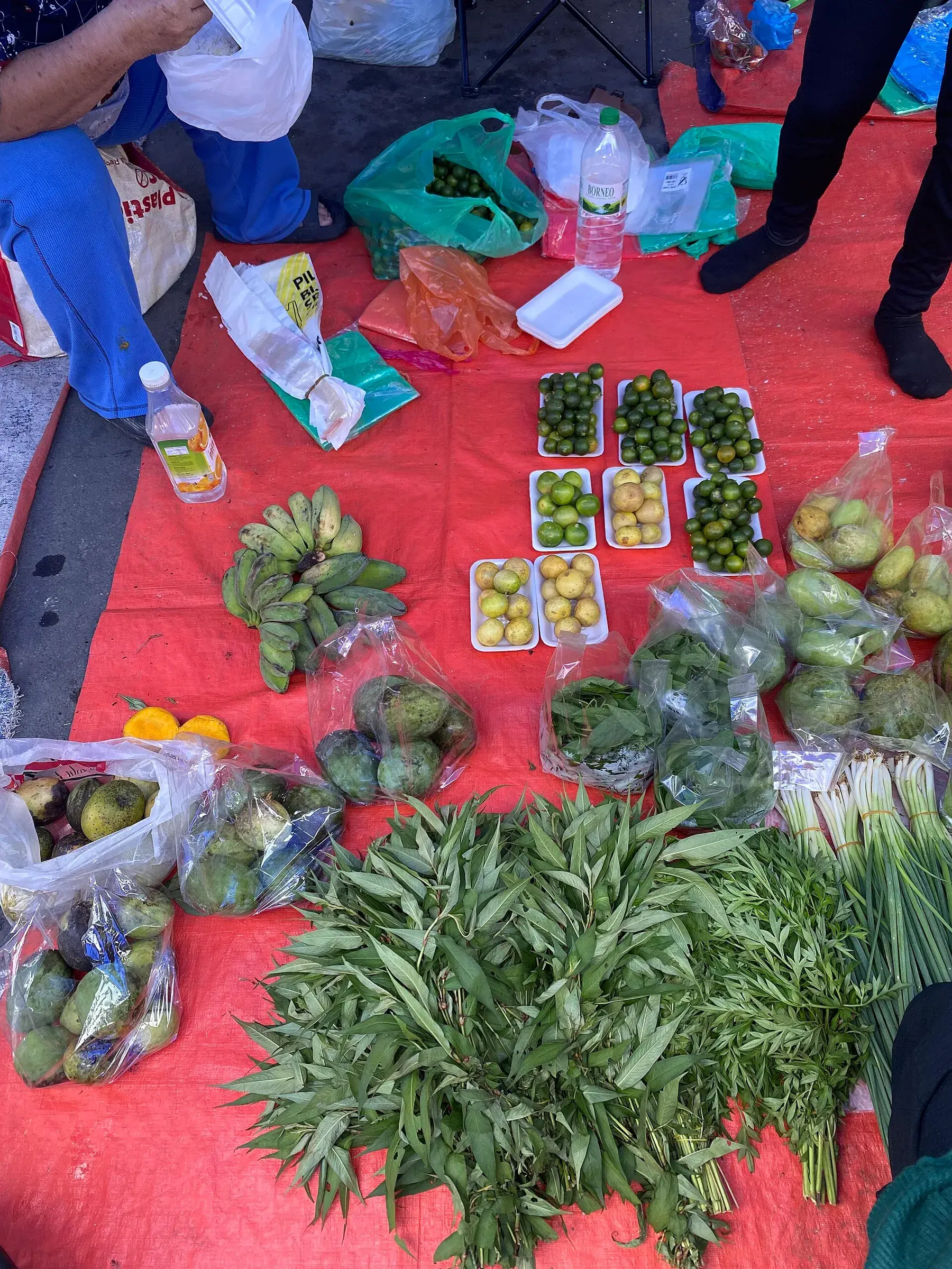 Vegetables laid out on a stall at the Tuaran tamu